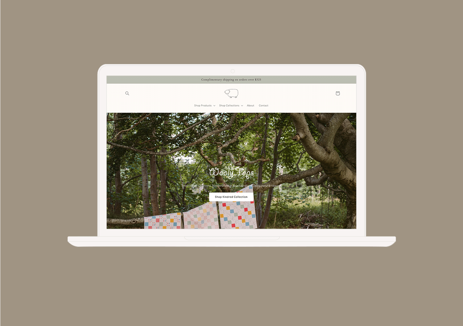 A digital mockup of the Wooly Top's website on a laptop.