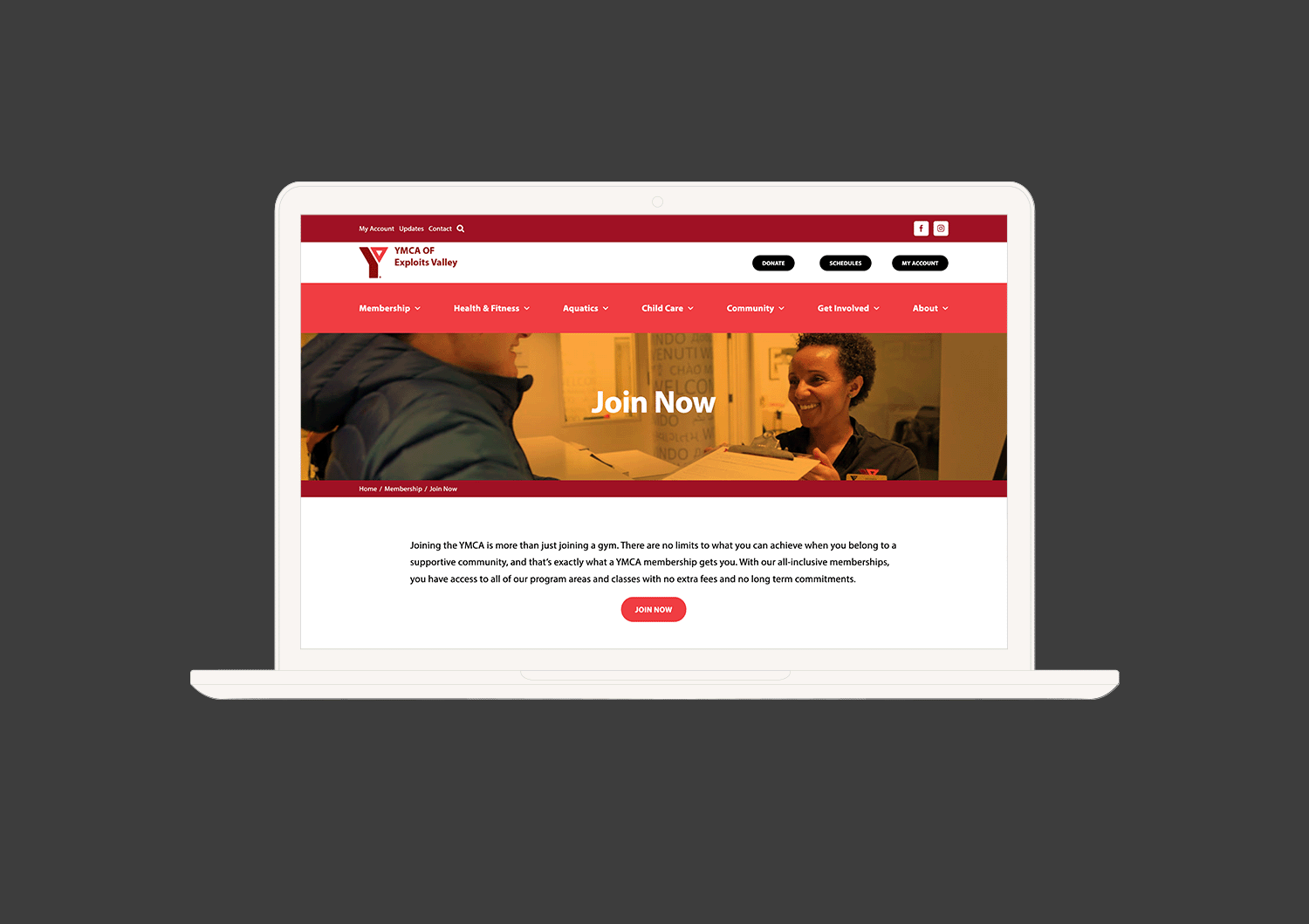 A mockup of the YMCA of Exploits Valley website displayed on a laptop.